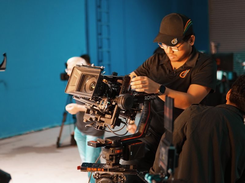 Camera and production equipment laid out before a shoot